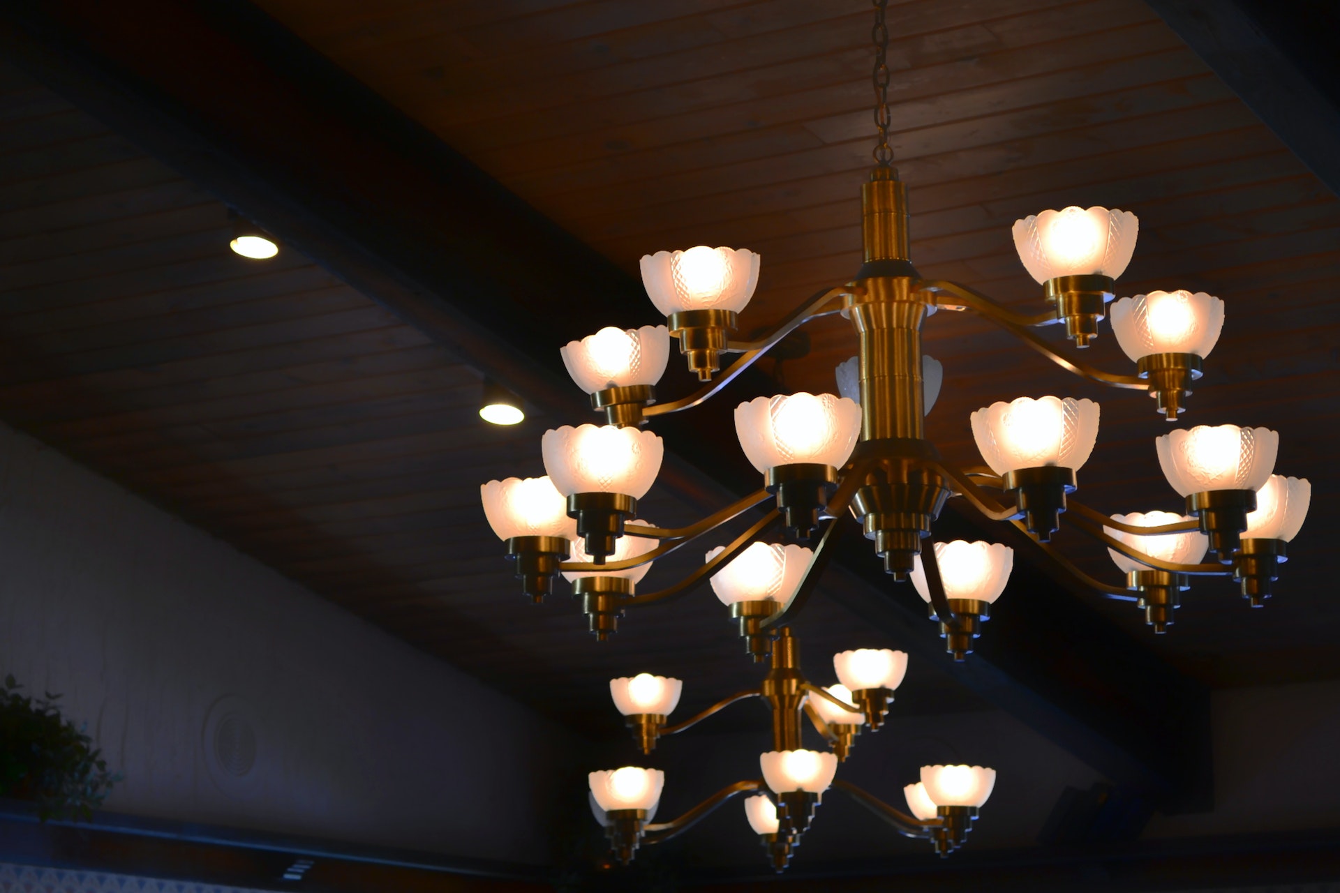 A grand chandelier adorned with numerous lights, illuminating the space with elegance and sophistication.