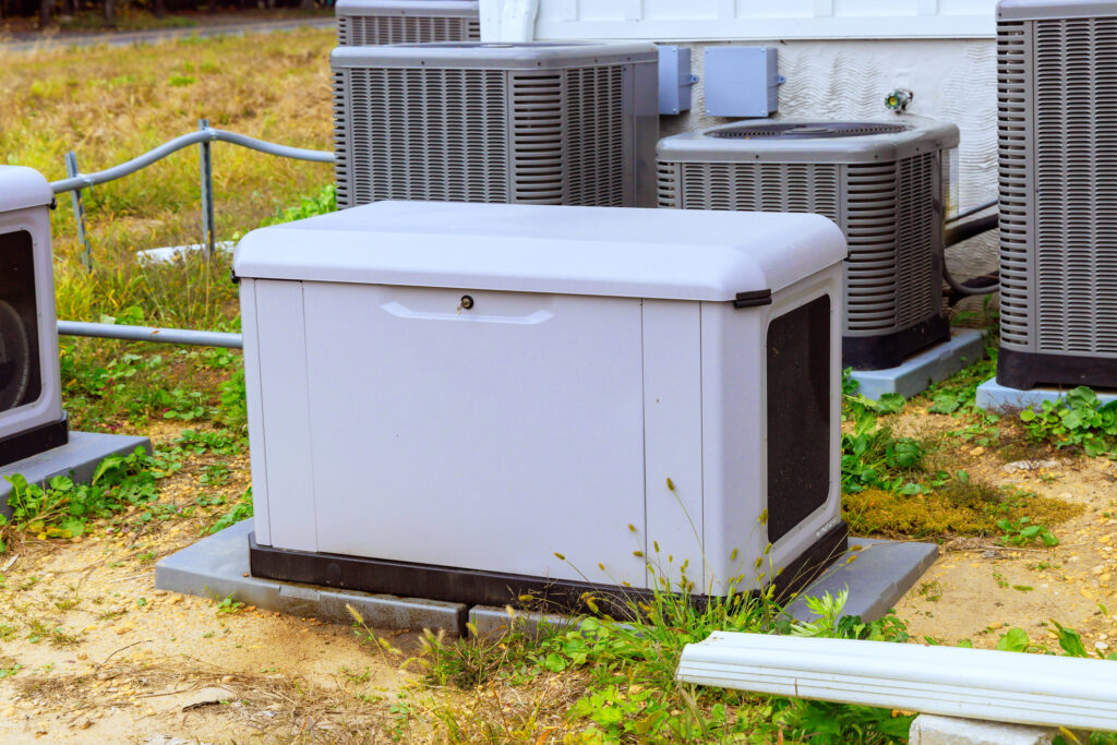 generator placed outside in front of HVAC units